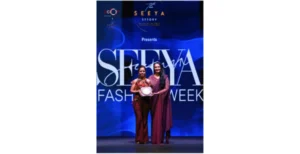 Jigyasa Joly receiving award at Seeya Fashion Week Delhi 2024