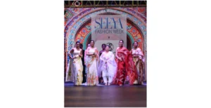 Shalaka Sreeram receiving award at Seeya Fashion Week Delhi 2024